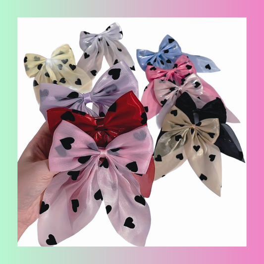 Shimmery satin ribbon hair bow clips with hearts