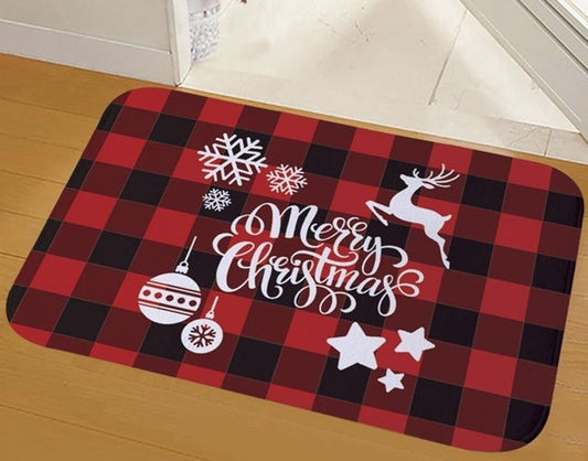 red and black checked flannel door mat saying merry christmas with snow flakes baubles and reindeer