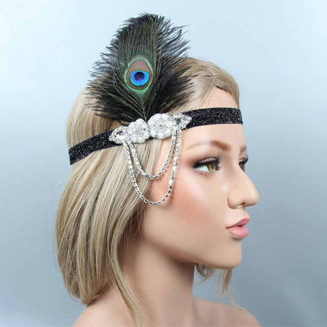 Gatsby 1920's glittery headband with silver embellishment and peacock father to the side