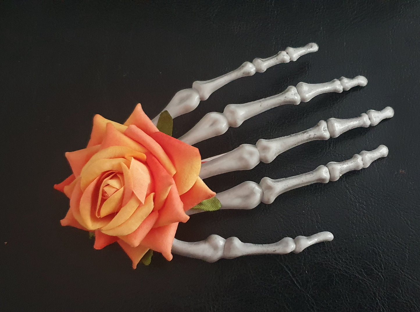 Large skeleton hand with rose hair clip