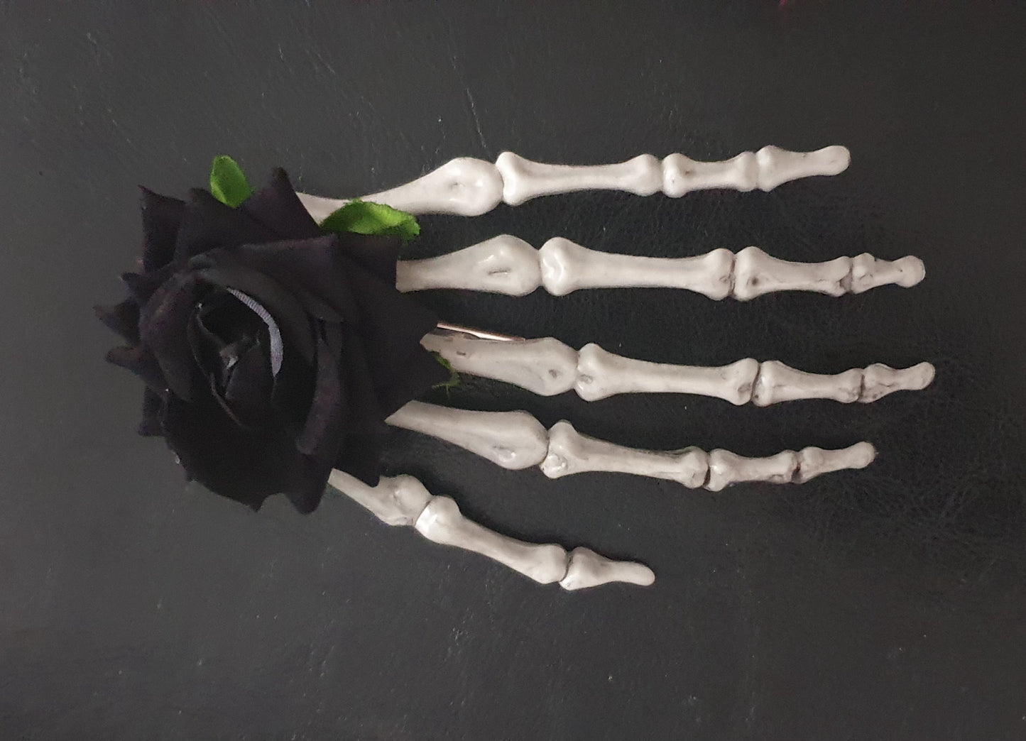 Large skeleton hand with rose hair clip