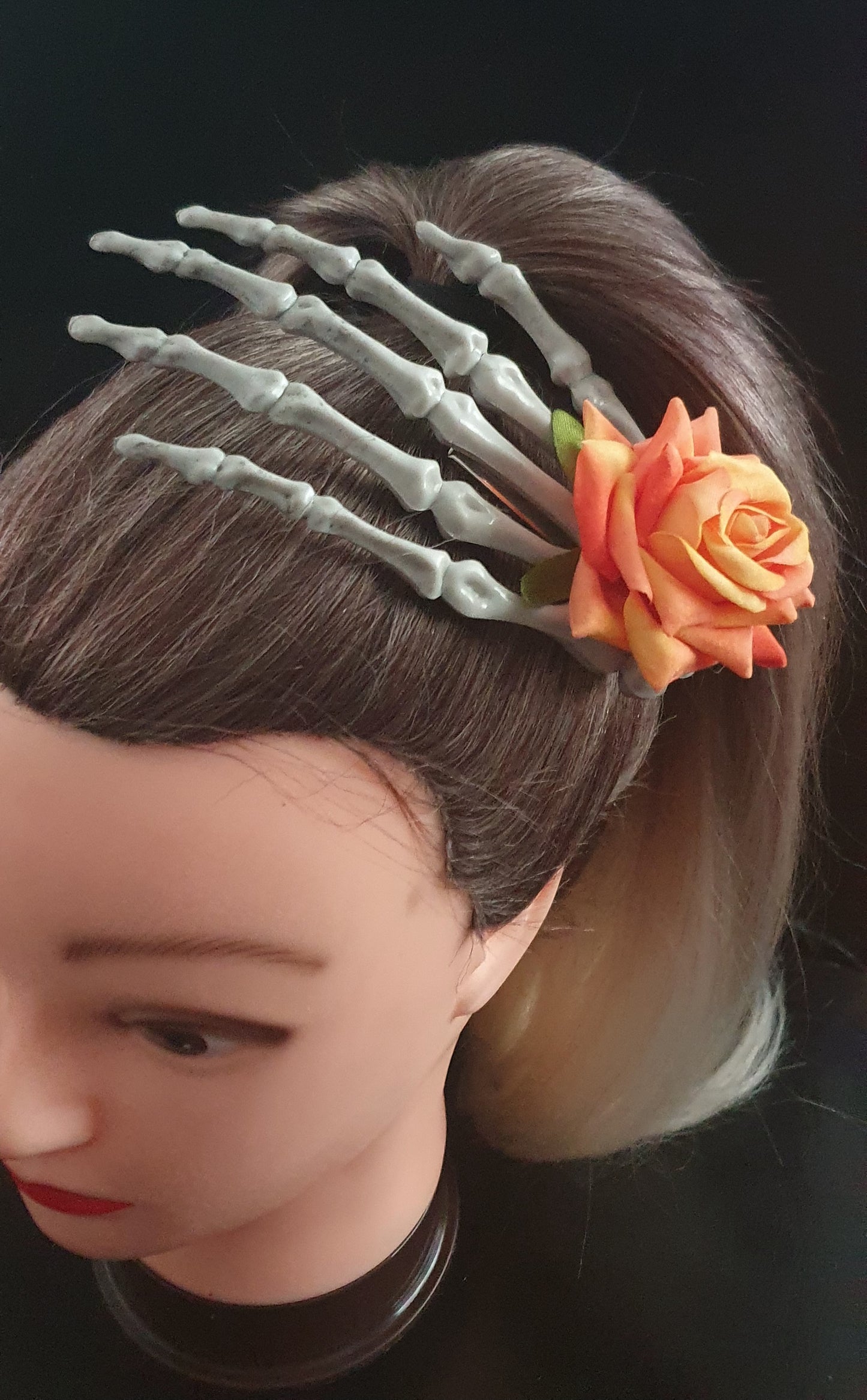 Large skeleton hand with rose hair clip