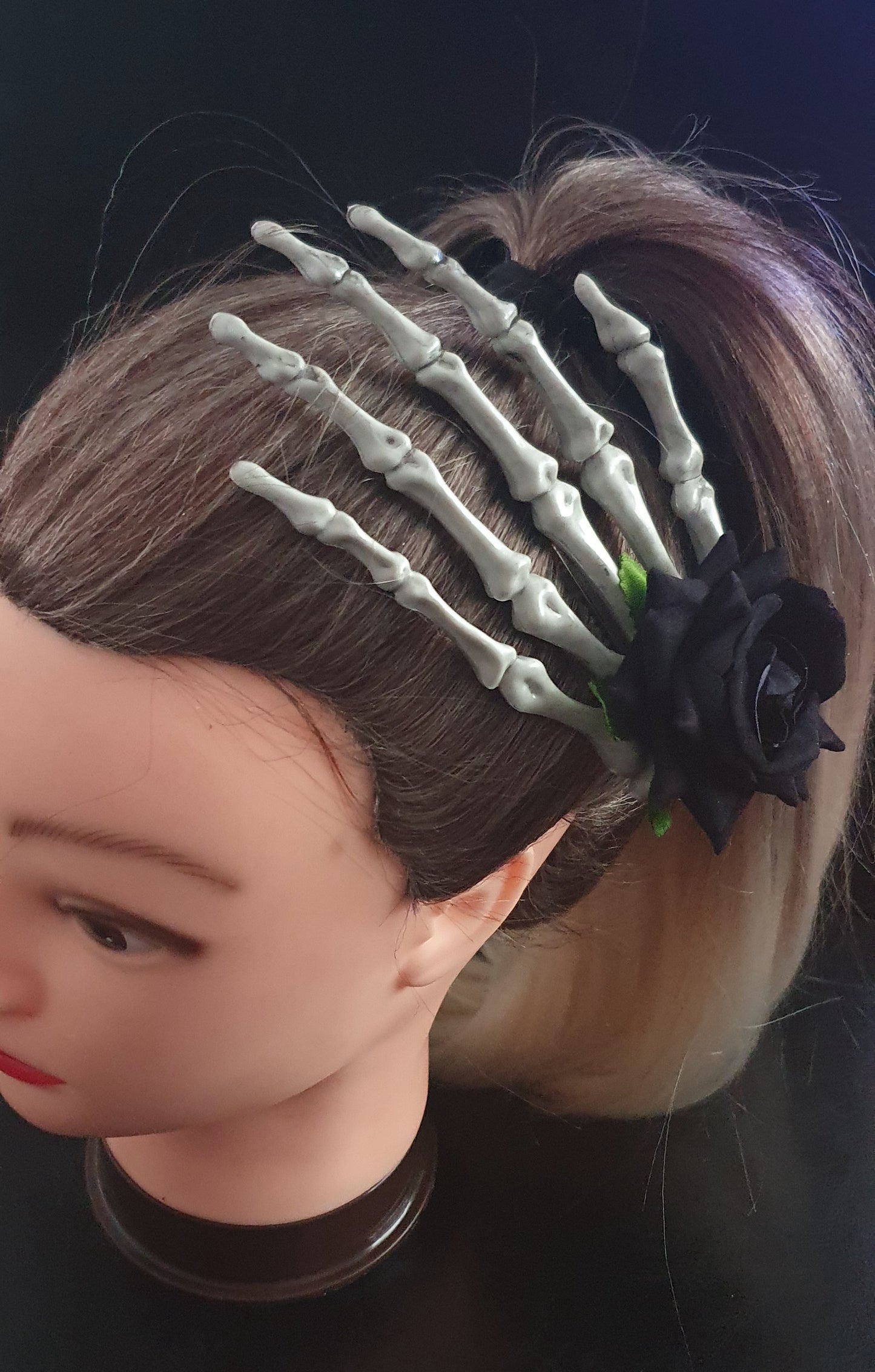 Large skeleton hand with rose hair clip