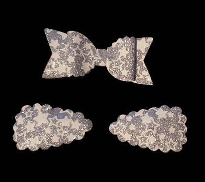 Shimmery star print bow and snap clip set
