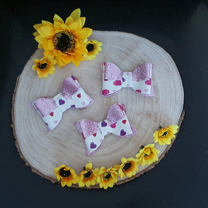 Pink shimmer heart hair bow