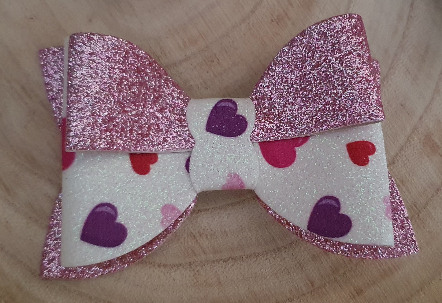 Pink shimmer heart hair bow