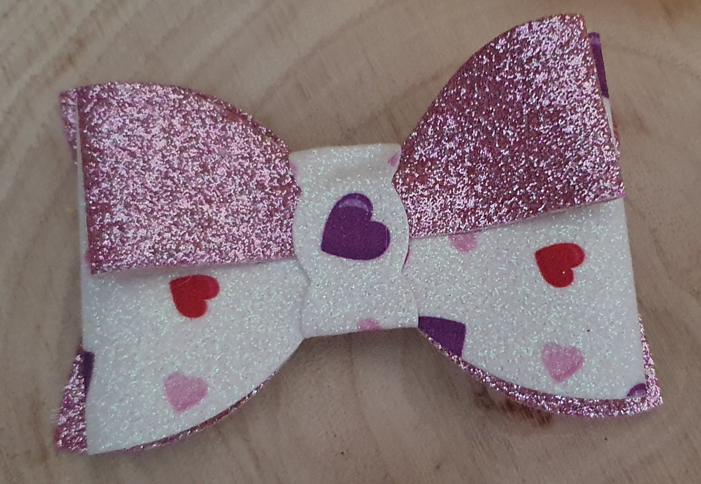 Pink shimmer heart hair bow