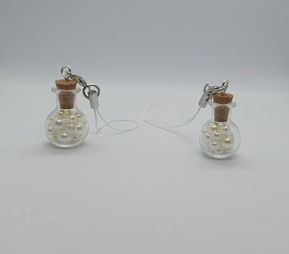 Glass potion bottle with faux pearl beads and rose keepsake charm