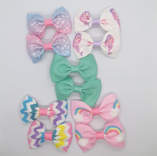 Colourful set of five pairs of hair bow clips