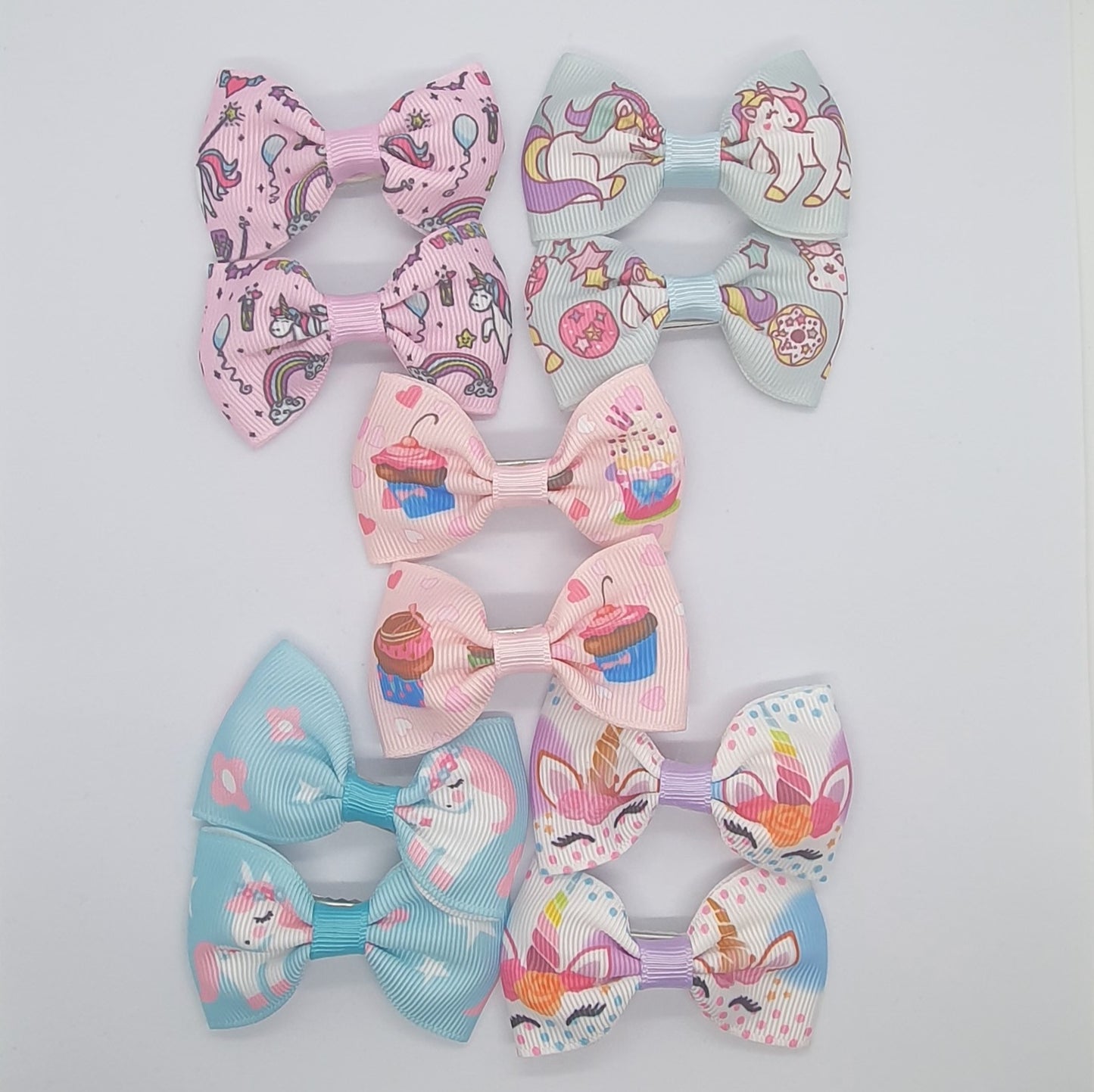 Colourful set of five pairs of hair bow clips