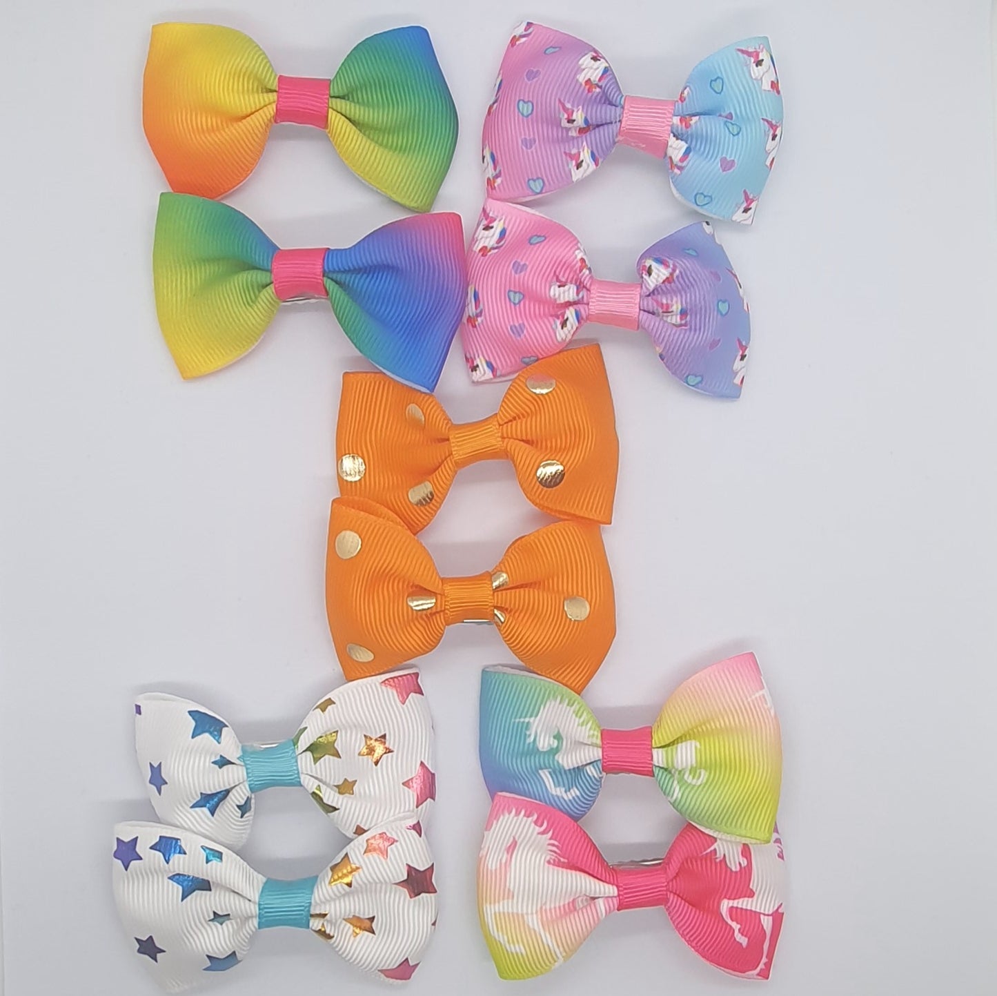 Colourful set of five pairs of hair bow clips