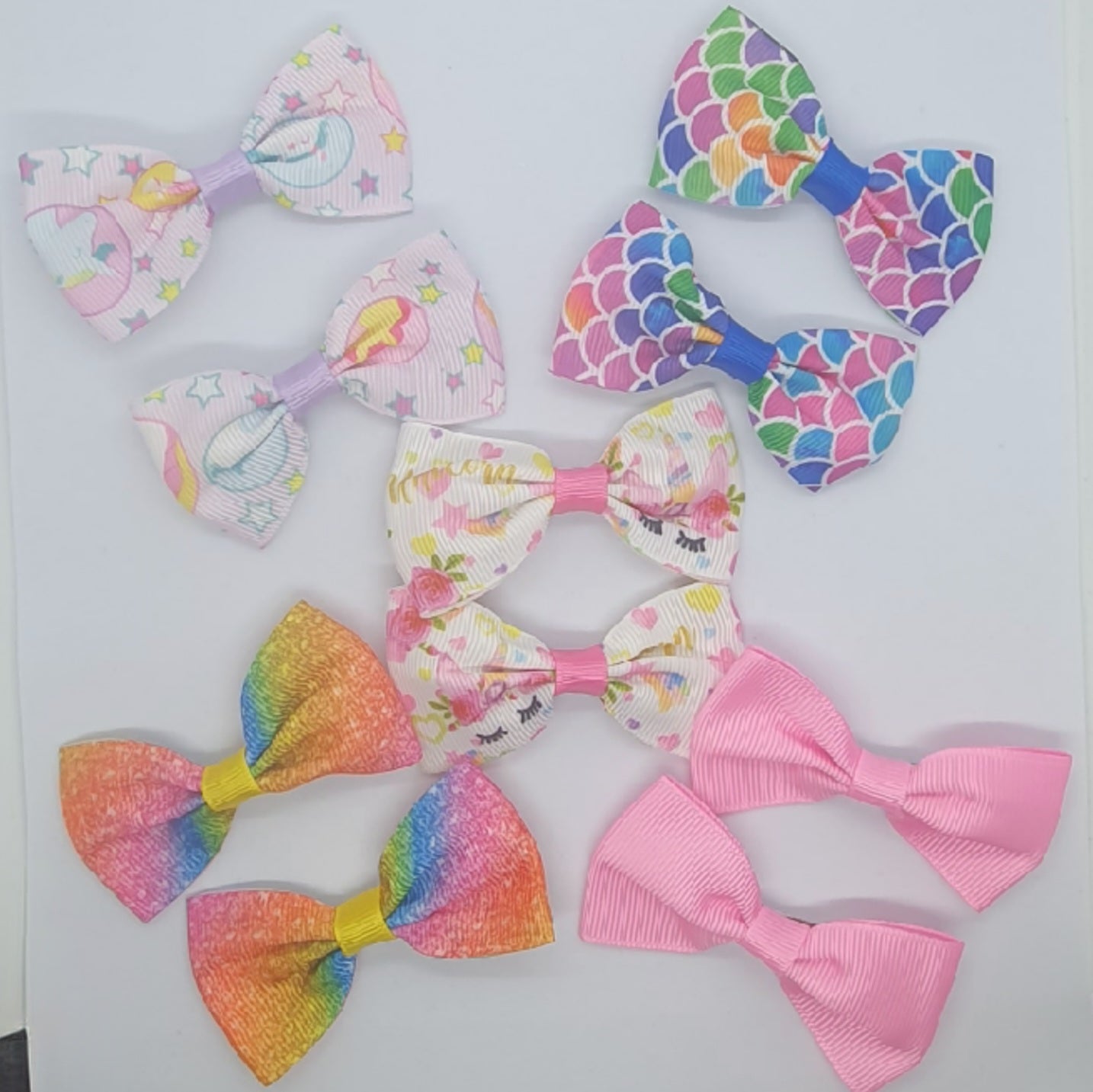 Colourful set of five pairs of hair bow clips