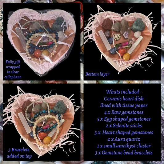 Heart‑shaped crystal bowl filled with gemstones and bracelets