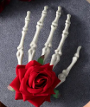 Large skeleton hand with rose hair clip