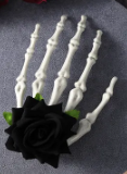 Large skeleton hand with rose hair clip