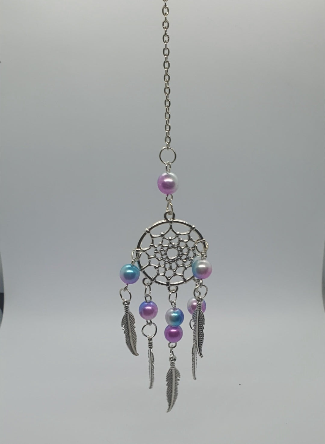 Dream catcher hanging ornament with beads and feather detail