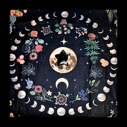 Polished black Flower Agate star carving with white blossom patterns, 42g, celestial crystal on moon backdrop.