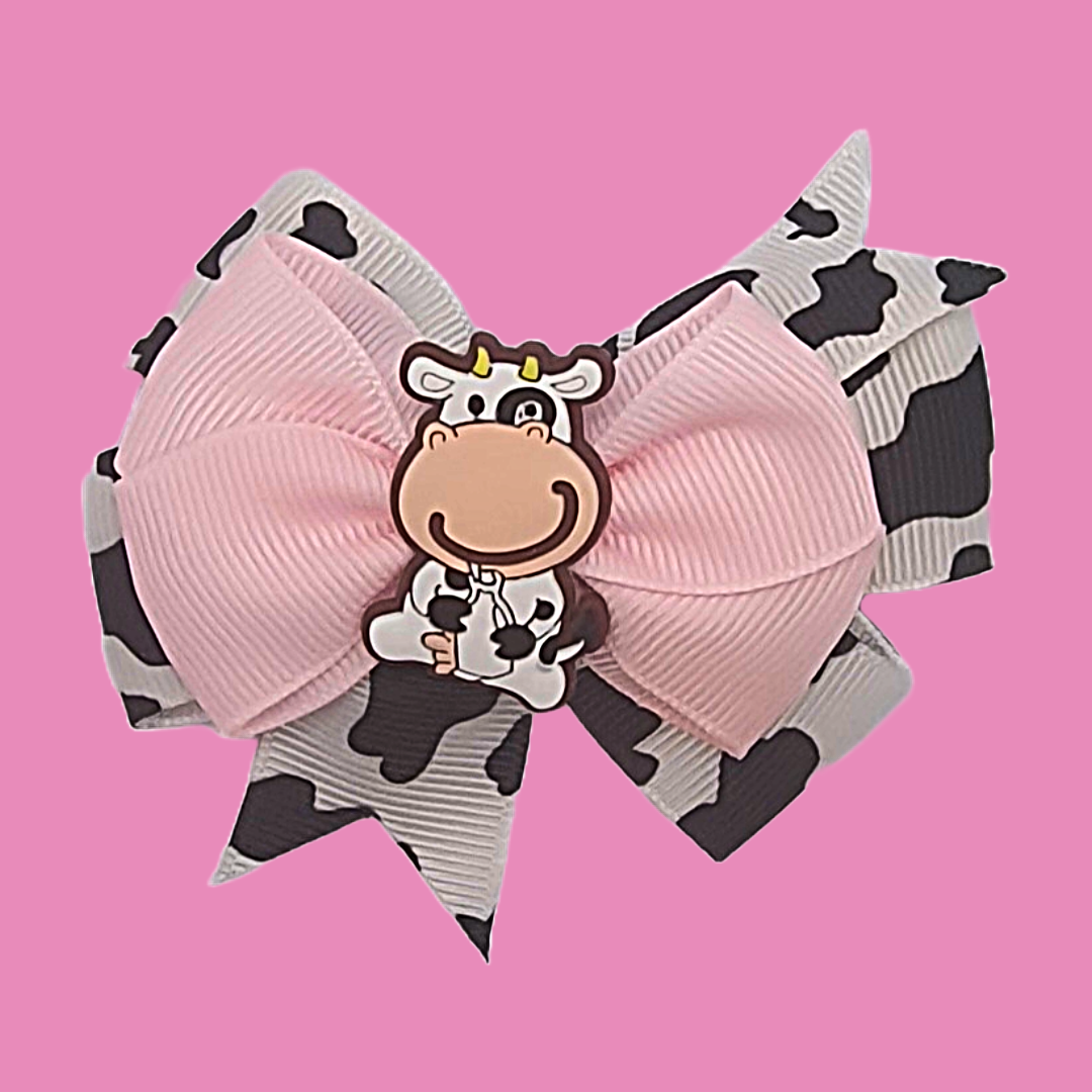 Cow print and pink ribbon bow hair clip set