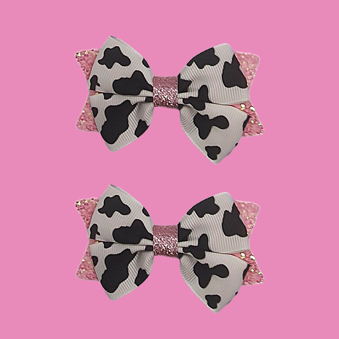 Cow print and pink ribbon bow hair clip set