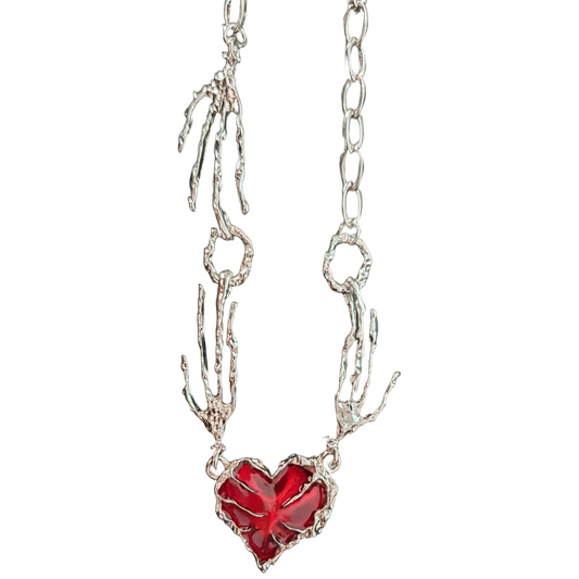 Blood red heart pendant with creepy bony hand and silver chain