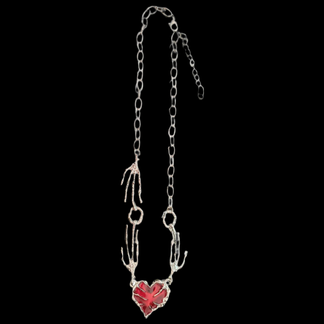 Blood red heart pendant with creepy bony hand and silver chain