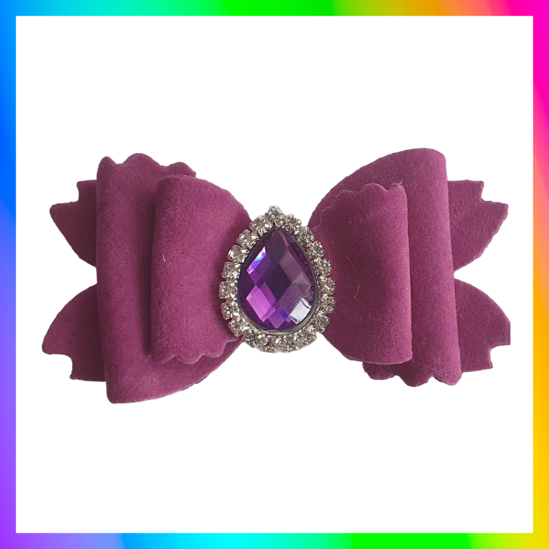 Soft velvet 3" double layered bow with droplet gem surrounded in little clear rhinestones on a crocodile clip comes in variety of colours