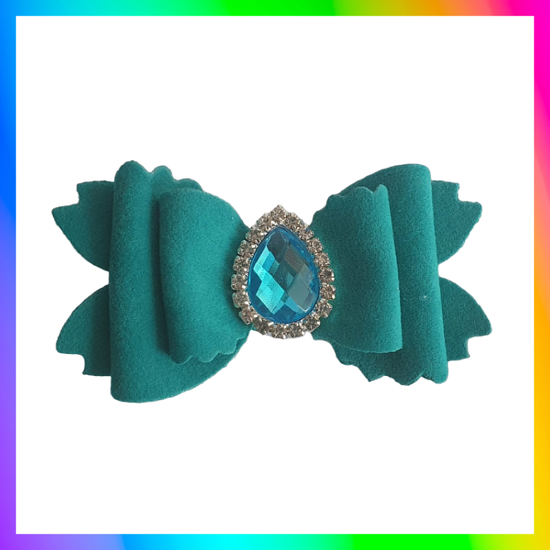 Soft velvet 3" double layered bow with droplet gem surrounded in little clear rhinestones on a crocodile clip comes in variety of colours