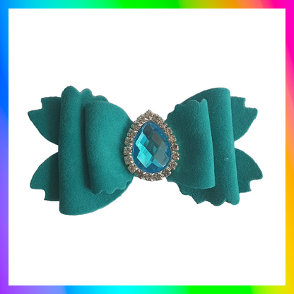Soft velvet 3" double layered bow with droplet gem surrounded in little clear rhinestones on a crocodile clip comes in variety of colours