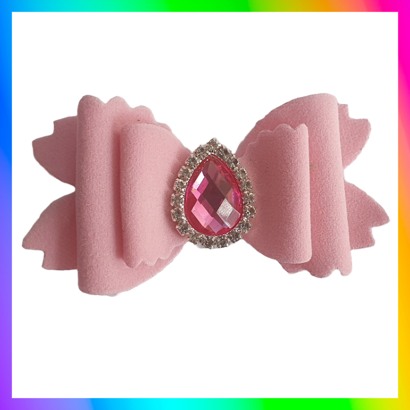 Soft velvet 3" double layered bow with droplet gem surrounded in little clear rhinestones on a crocodile clip comes in variety of colours