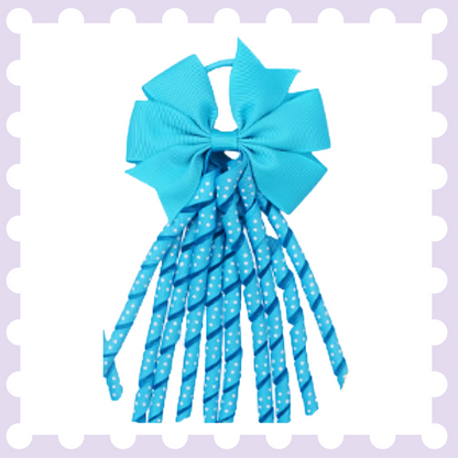 Pair of ribbon hair bow bobbles with polka dot curly ribbon tassels