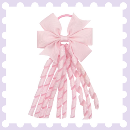 Pair of ribbon hair bow bobbles with polka dot curly ribbon tassels