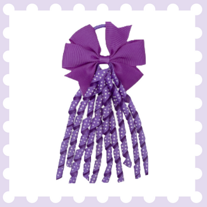 Pair of ribbon hair bow bobbles with polka dot curly ribbon tassels