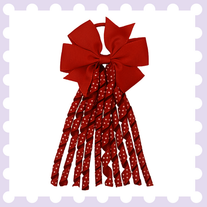 Pair of ribbon hair bow bobbles with polka dot curly ribbon tassels