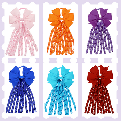 Pair of ribbon hair bow bobbles with polka dot curly ribbon tassels