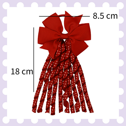 Pair of ribbon hair bow bobbles with polka dot curly ribbon tassels