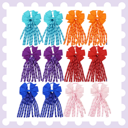 Pair of ribbon hair bow bobbles with polka dot curly ribbon tassels