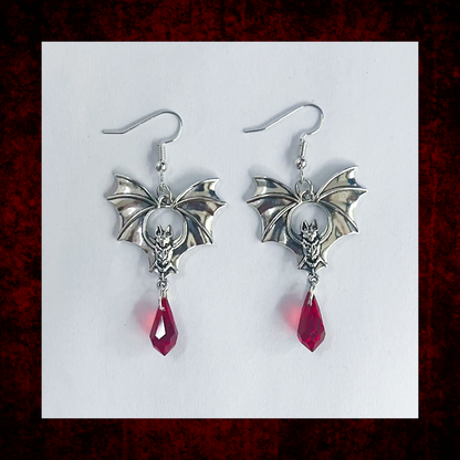 Bat dangly earrings with red bead blood droplet