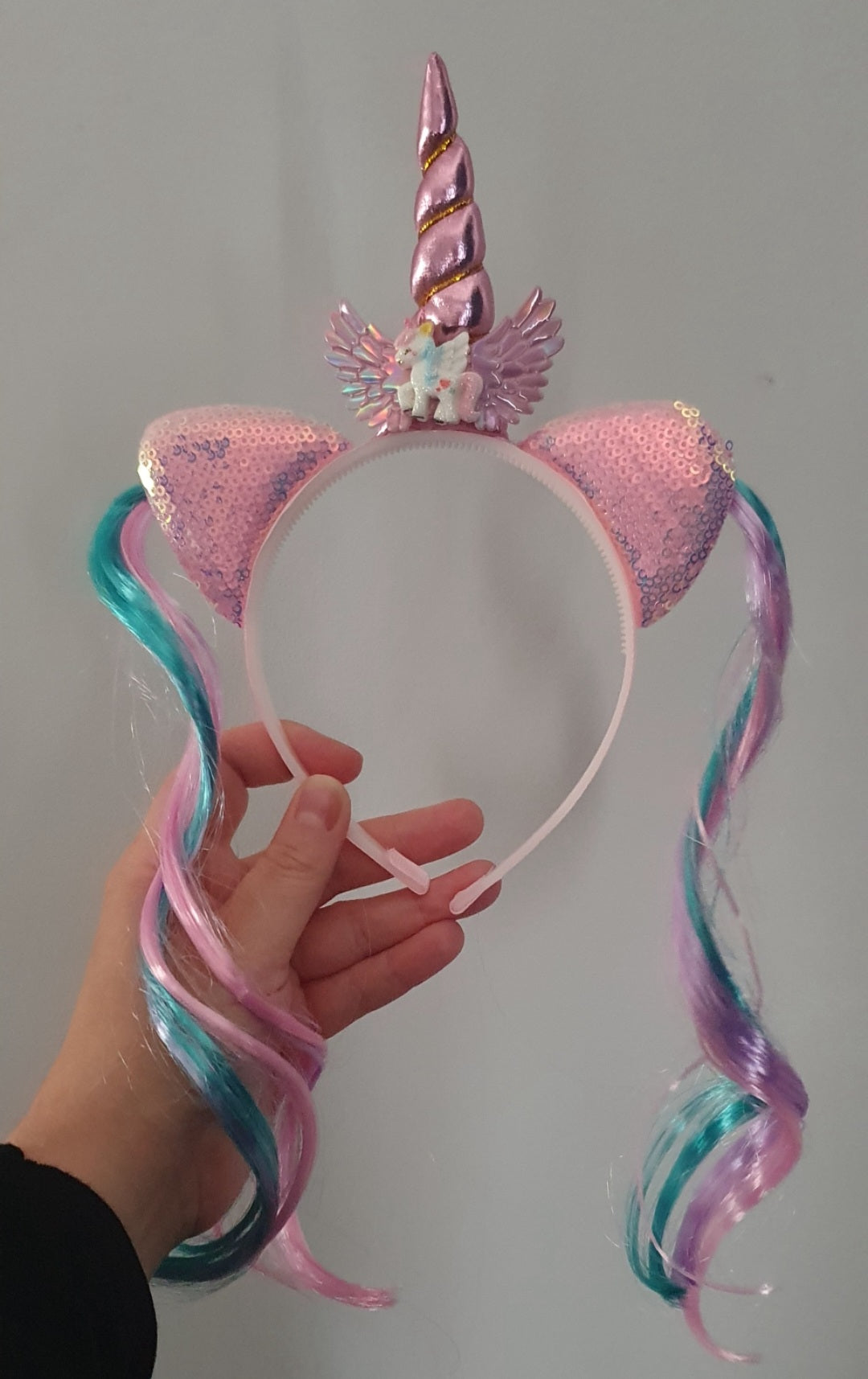 Unicorn themed girls headband with unicorn horn, ears and faux colourful pink blue hair extensions