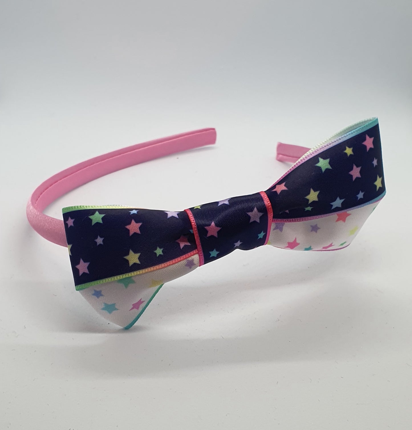 Satin headband with starry ribbon bows