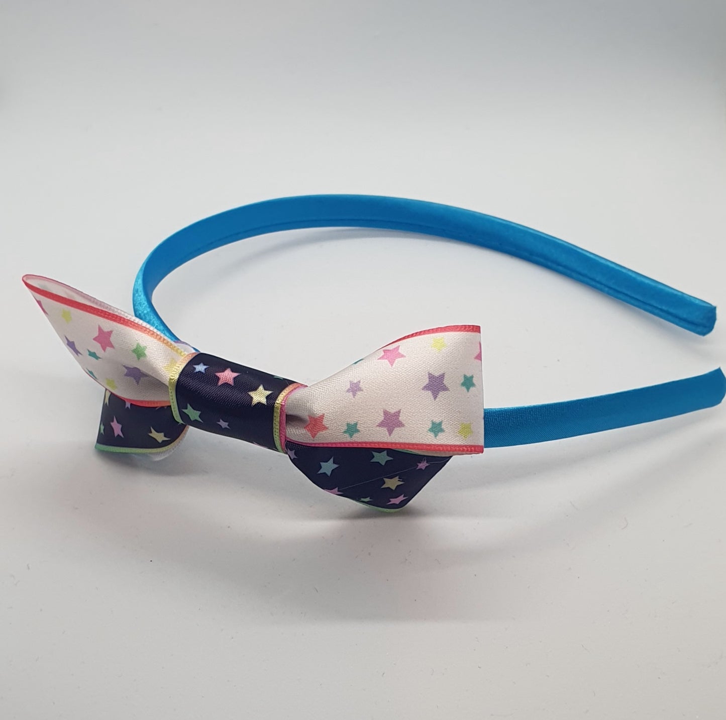 Satin headband with starry ribbon bows