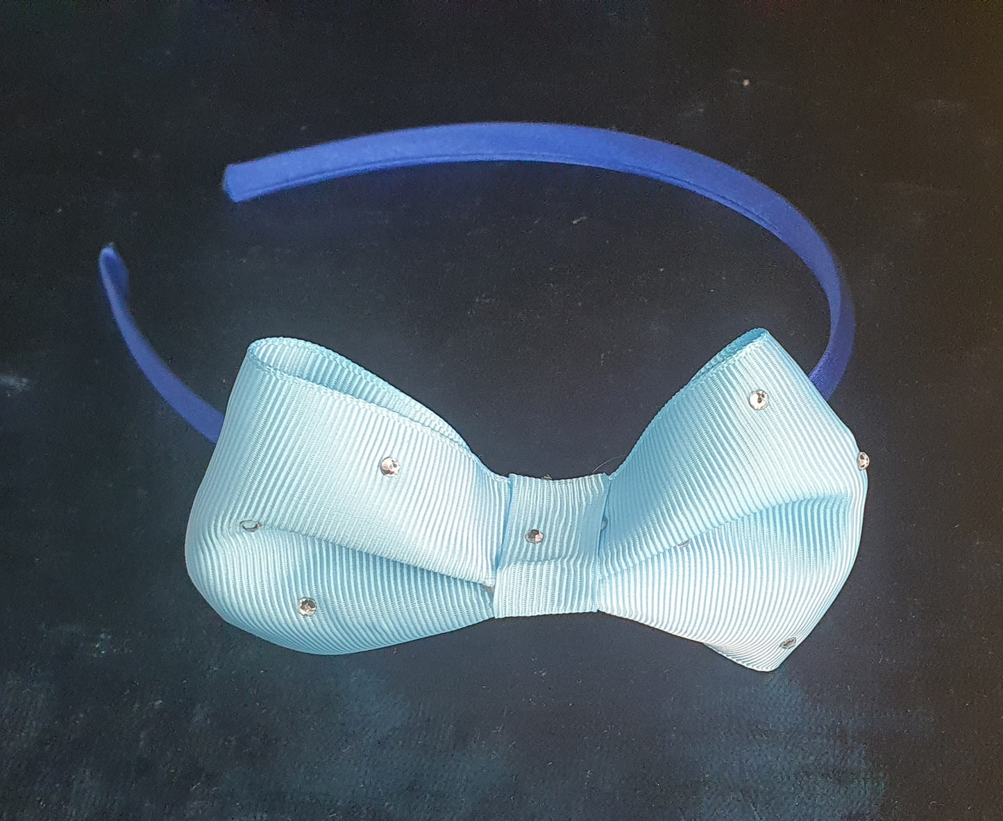 royal blue satin headband with pale blue gemmed bow