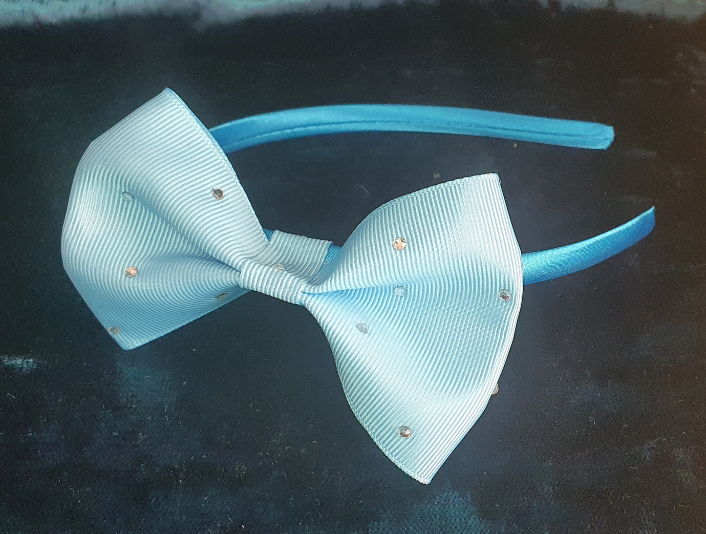 baby blue satin headband with pale blue gemmed bow