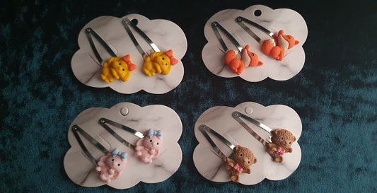 all four sets of animal snap clip sets - yellow dog, orange fox, pink bunny and brown bear