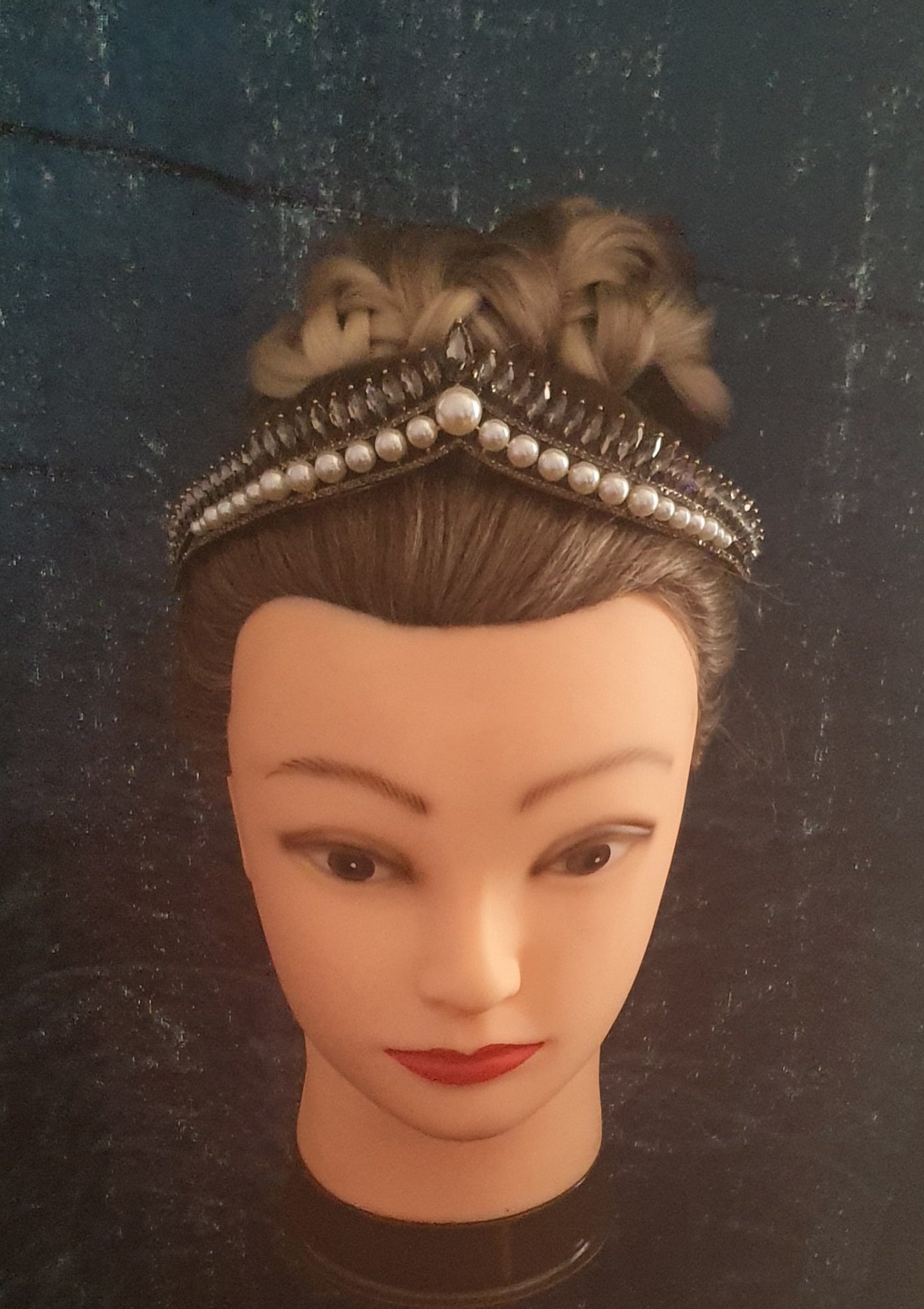 beautiful delicate tiara featuring pearl beads at the bottom and black rhinestone crystals across the top