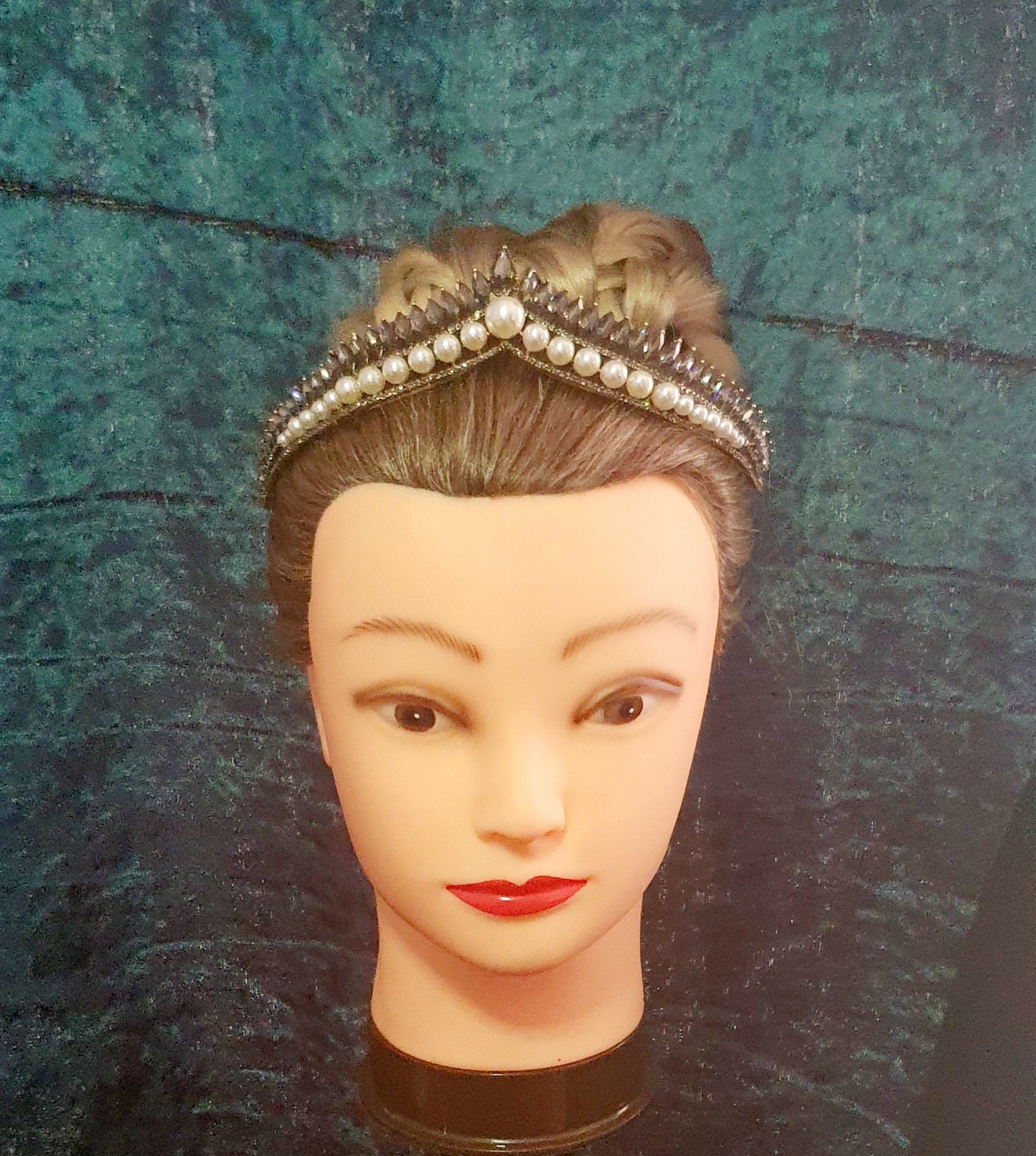 beautiful delicate tiara featuring pearl beads at the bottom and black rhinestone crystals across the top