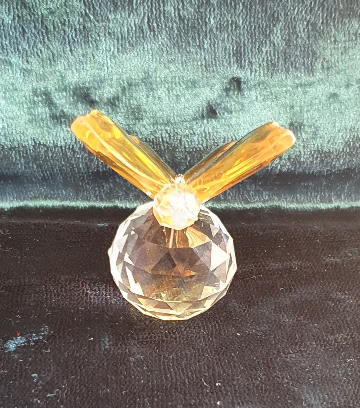 front of yellow butterfly crystal figure