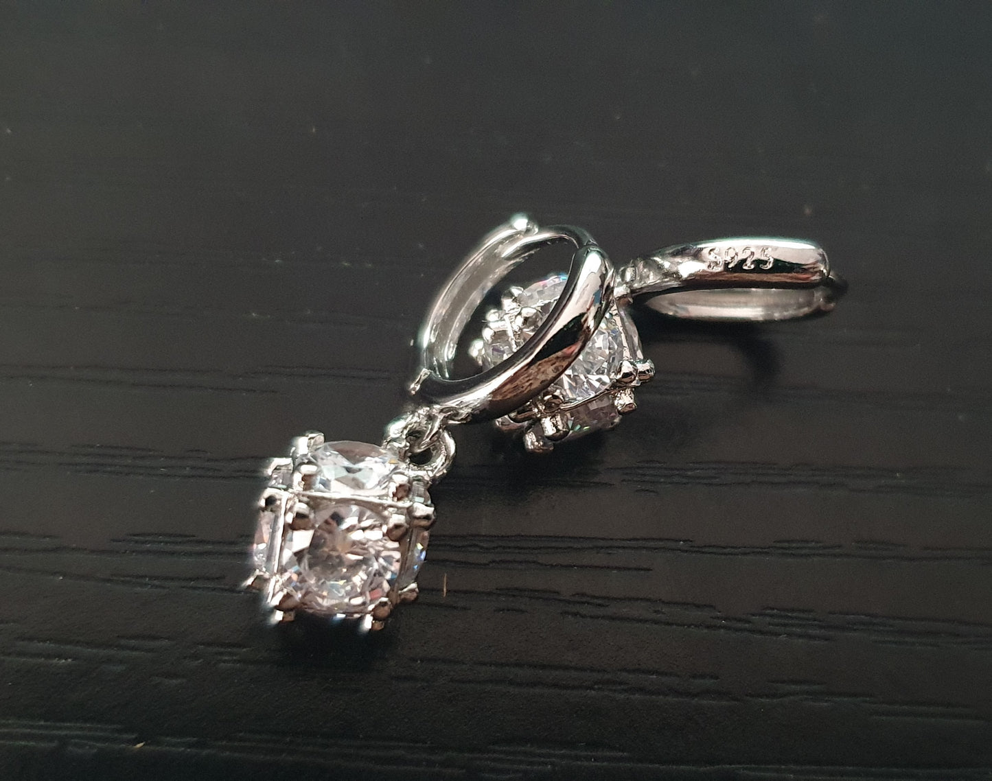 Silver hoop dangly earrings with cubic zirconia