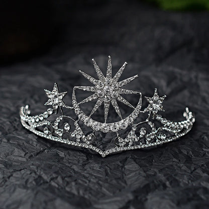 front view of The tiara is silver coloured with clear rhinestone crystals featuring a stunning celestial sun, moon and star theme