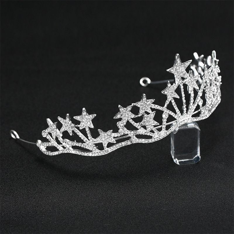 This stunning piece is silver in colour and features a starry design covered in clear crystal rhinestones - side view