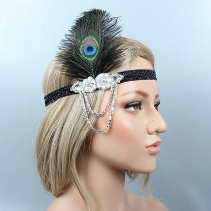 Gatsby 1920's glittery headband with silver embellishment and peacock father to the side 